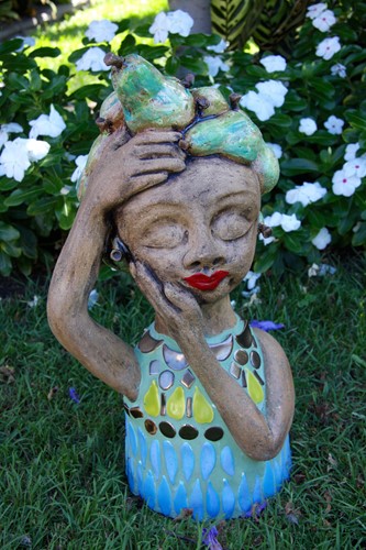 Small garden dweller with pears in hair